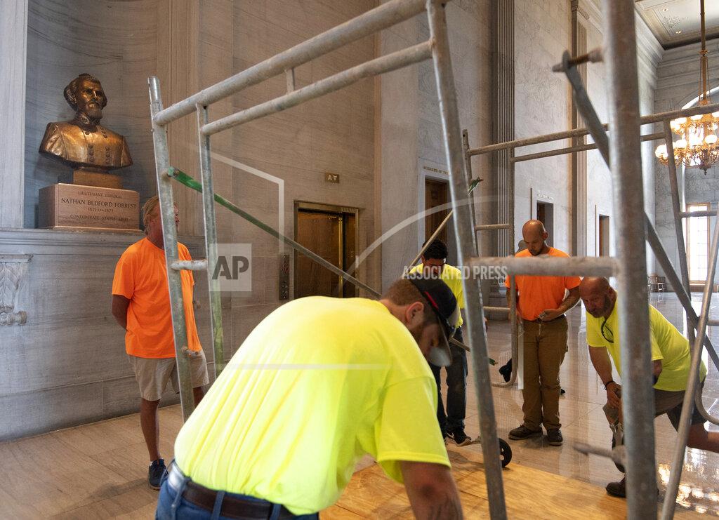 George Walker Iv Workers prepare scaffolding in front of a bust of Confederate general and early Ku Klux Klan leader Nathan Bedford Forrest at the State Capitol Thursday, July 22, 2021, in Nashville, Tenn. A decadeslong effort to remove the bust from the Tennessee Capitol cleared its final hurdle Thursday, with state leaders approving the final vote needed to allow the statue to be relocated to a museum. (George Walker IV/The Tennessean via AP)