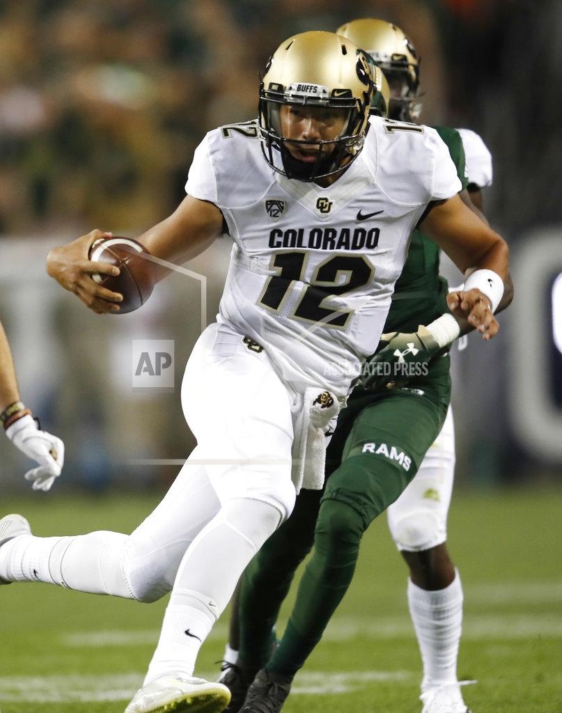 David Zalubowski Colorado quarterback Steven Montez, front, runs past Colorado State cornerback Rashad Ajayi on the way to a touchdown in the first half of an NCAA college football game Friday, Aug. 31, 2018, in Denver. (AP Photo/David Zalubowski)