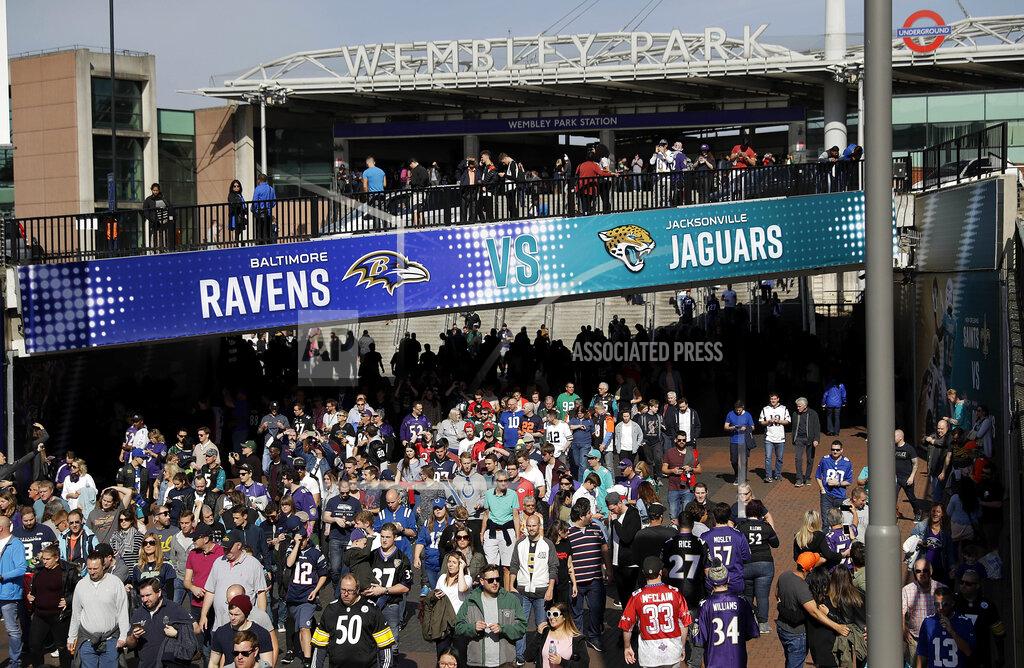 Matt Dunham FILE - In this Sept. 24, 2017, file photo, fans walk up Wembley Way as they arrive for an NFL football game between the Jacksonville Jaguars and the Baltimore Ravens at Wembley Stadium in London. As the league celebrates its 100th season, it continues to expand its foreign footprint with five international games in 2019. Four are in London, including two at Wembley Stadium, and the league returns to Mexico. (AP Photo/Matt Dunham, File)