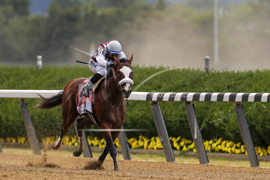 Seth Wenig Tiz the Law (8), with jockey Manny Franco up, approaches the finish line on his way to win the152nd running of the Belmont Stakes horse race, Saturday, June 20, 2020, in Elmont, N.Y. (AP Photo/Seth Wenig)