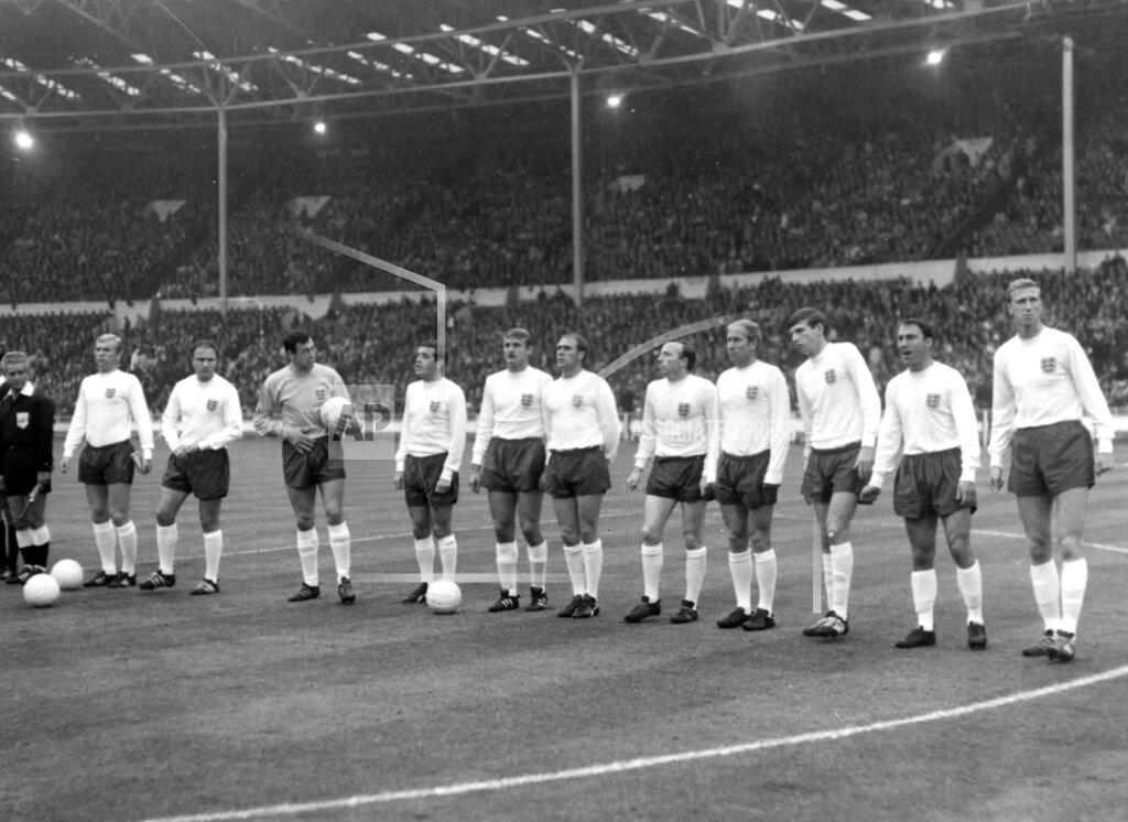 Uncredited FILE - In this July 20, 1966 file photo, England line-up before their soccer World Cup match against France, at Wembley Stadium, London, from second left. Bobby Moore, George Cohen, Gordon Banks, Ian Callaghan, Roger Hunt, Ramon Wilson, Nobby Stiles, Bobby Charlton, Martin Peters, Jimmy Greaves and Jackie Charlton. Jimmy Greaves, one of England’s greatest goal-scorers who was prolific for Tottenham, Chelsea and AC Milan has died. He was 81. With 266 goals in 379 appearances, Greaves was the all-time record scorer for Tottenham, which announced his death on Sunday, Sept. 19, 2021. (Bippa via AP, File)