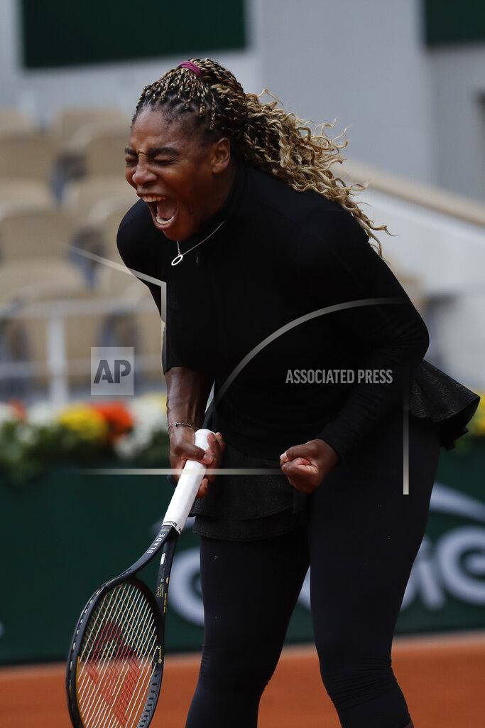 Alessandra Tarantino Serena Williams of the U.S. screams in the first round match of the French Open tennis tournament against Kristie Ahn of the U.S. at the Roland Garros stadium in Paris, France, Monday, Sept. 28, 2020. (AP Photo/Alessandra Tarantino)