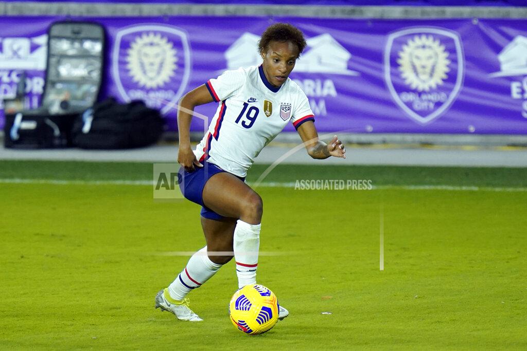 John Raoux FILE - United States defender Crystal Dunn (19) moves the ball against Colombia during the second half of an international friendly soccer match in Orlando, Fla., in this Monday, Jan. 18, 2021, file photo. The 28-year-old U.S. national team defender has grown more confident in her abilities and her status on the U.S. women’s national team. She’s also become empowered in her activism as a Black woman. So much so that she even proclaimed herself the "New Crystal Dunn.” (AP Photo/John Raoux)