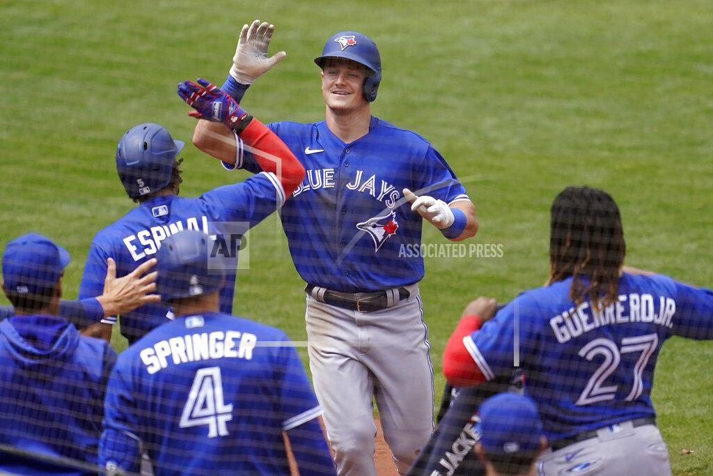 Jeff Chiu Toronto Blue Jays' Matt Chapman, top, is congratulated by teammates after hitting a home run against the Oakland Athletics during the seventh inning of a baseball game in Oakland, Calif., Wednesday, July 6, 2022. (AP Photo/Jeff Chiu)