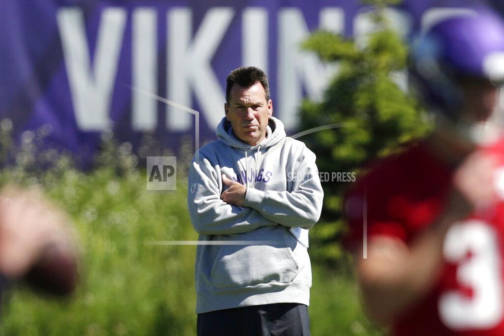 Andy Clayton-King FILE - In this June 13, 2019, file photo, Minnesota Vikings assistant head coach and offensive advisor Gary Kubiak watches quarterbacks during drills at the team's NFL football training facility in Eagan, Minn. Kubiak's addition to the Minnesota Vikings coaching staff as a senior adviser has made a clear positive impact. This week, the Vikings host his long-time employer, the Denver Broncos, the team he served as head coach for in the 2015-16 seasons. (AP Photo/Andy Clayton- King, File)
