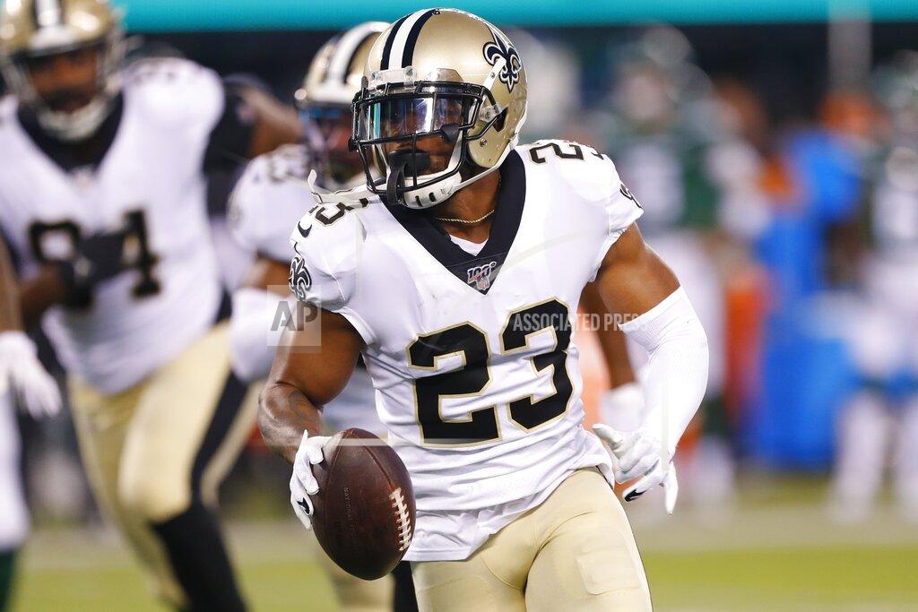 Noah K. Murray New Orleans Saints' Marshon Lattimore (23) runs back a fumble recovery during the first half of the team's preseason NFL football game against the New York Jets on Saturday, Aug. 24, 2019, in East Rutherford, N.J. (AP Photo/Noah K. Murray)
