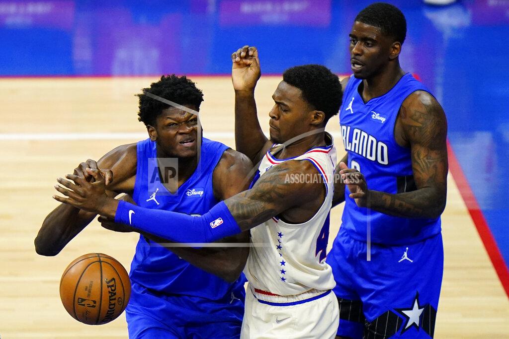 Matt Slocum Orlando Magic's Mo Bamba, left, cannot get a shot past Philadelphia 76ers' Paul Reed, center, as Dwayne Bacon looks on during the second half of an NBA basketball game, Sunday, May 16, 2021, in Philadelphia. (AP Photo/Matt Slocum)