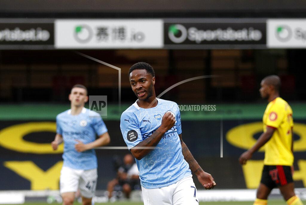 Adrian Dennis Manchester City's Raheem Sterling celebrates after scoring his side's opening goal during the English Premier League soccer match between Watford and Manchester City at the Vicarage Road Stadium in Watford, England, Tuesday, July 21, 2020. (Adrian Dennis/Pool via AP)