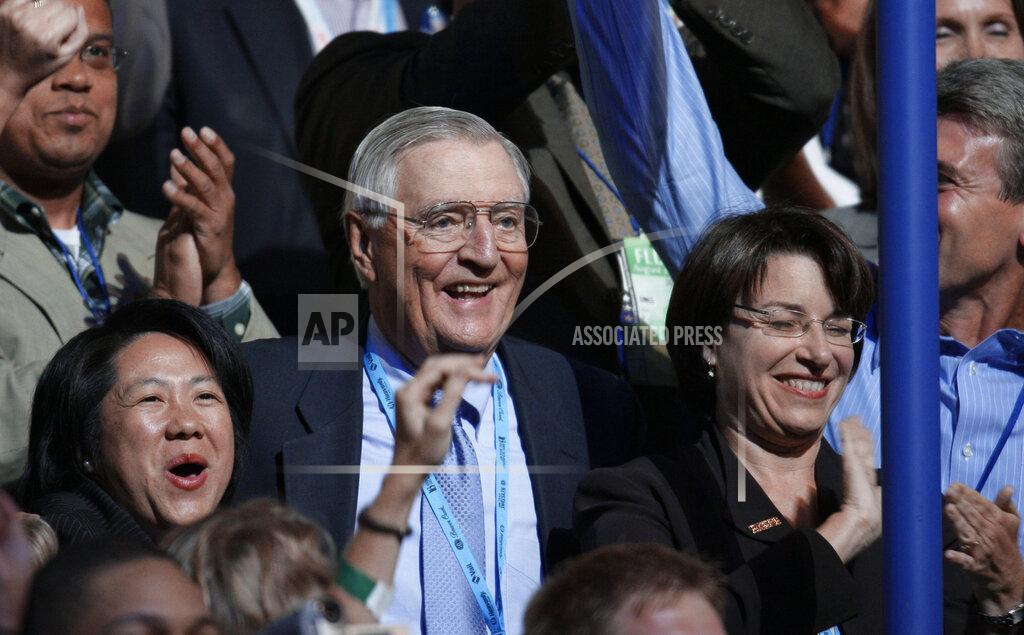 Charlie Neibergall FILE - In this Wednesday, Aug. 27, 2008, file photo, former Vice President Walter Mondale, center, and Sen. Amy Klobuchar, D-Minn., right, are seen after announcing their presidential nominee during the roll call of states on the third day of the Democratic National Convention in Denver. Mondale, a liberal icon who lost the most lopsided presidential election after bluntly telling voters to expect a tax increase if he won, died Monday, April 19, 2021. He was 93. (AP Photo/Charlie Neibergall, File)