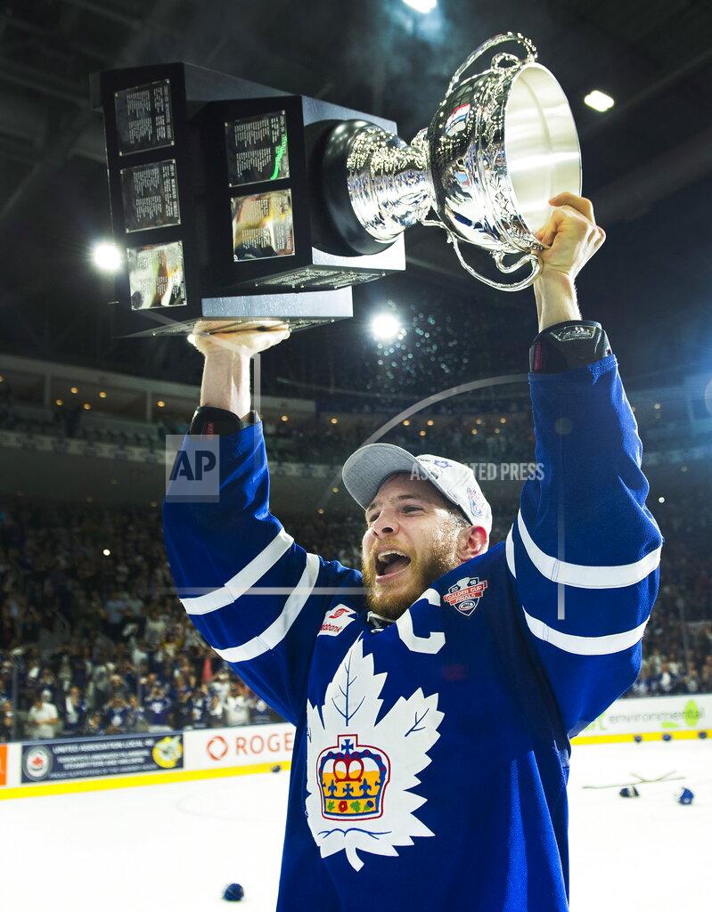 Nathan Denette FILE - In this June 14, 2018, file photo, Toronto Marlies right wing Ben Smith hoists the Calder Cup after Game 7 of the AHL Calder Cup final against the Texas Stars in Toronto. The American Hockey League has canceled the rest of its season because of the coronavirus pandemic. President and CEO David Andrews announced the league ‘has determined that the resumption and completion of the 2019-20 season is not feasible in light of current conditions.’ The AHL's Board of Governors made that determination in a conference call Friday, May 8, 2020. (Nathan Denette/The Canadian Press via AP, File)