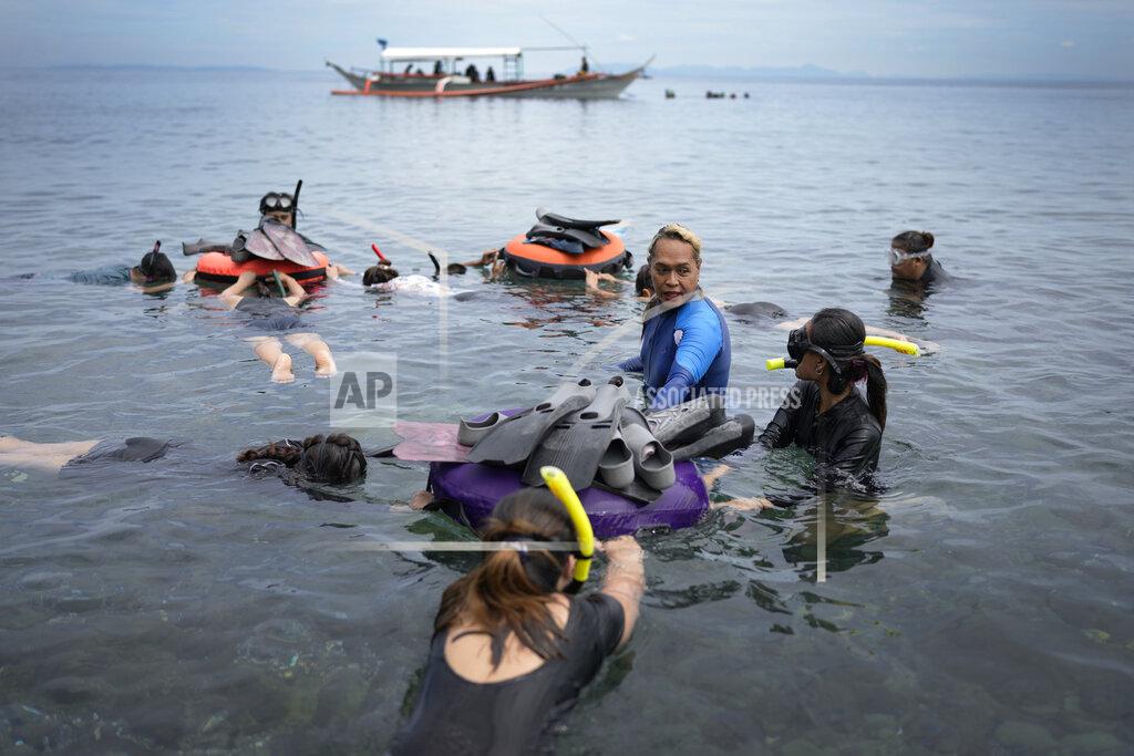 Aaron Favila Queen Pangke Tabora conducts a freediving classs at the Ocean Camp in Mabini, Batangas province, Philippines on Saturday, May 21, 2022. There was a pivotal moment in her life that eclipsed all others: It was the moment, she says, when she first slid her legs into a mermaid tail. (AP Photo/Aaron Favila)