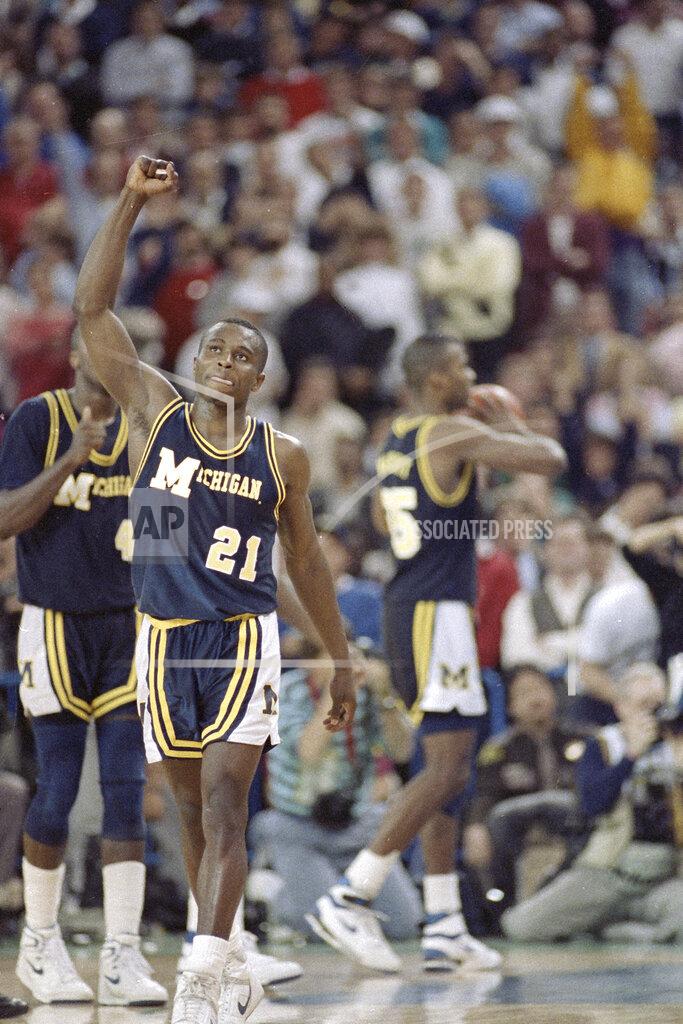 Uncredited FILE - In this April 4, 1989, file photo, Michigan's Rumeal Robinson celebrates making the first of two free throws with three seconds remaining in overtime against Seton Hall in the NCAA college basketball Final Four championship game in Seattle. Michigan defeated Seton Hall 80-79 (AP Photo/File)