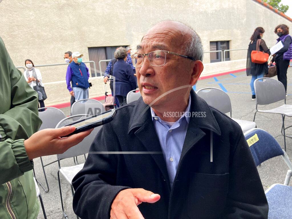 Amy Taxin Shoei Su, a retired appraiser, is interviewed by the media nearly a week after a deadly shooting at a Taiwanese American church congregation in Laguna Woods, Calif., Saturday, May 21, 2022. He said the shooter said nothing before firing on churchgoers who were snapping photos after finishing lunch following last Sunday morning's prayer service. (AP Photo/Amy Taxin)