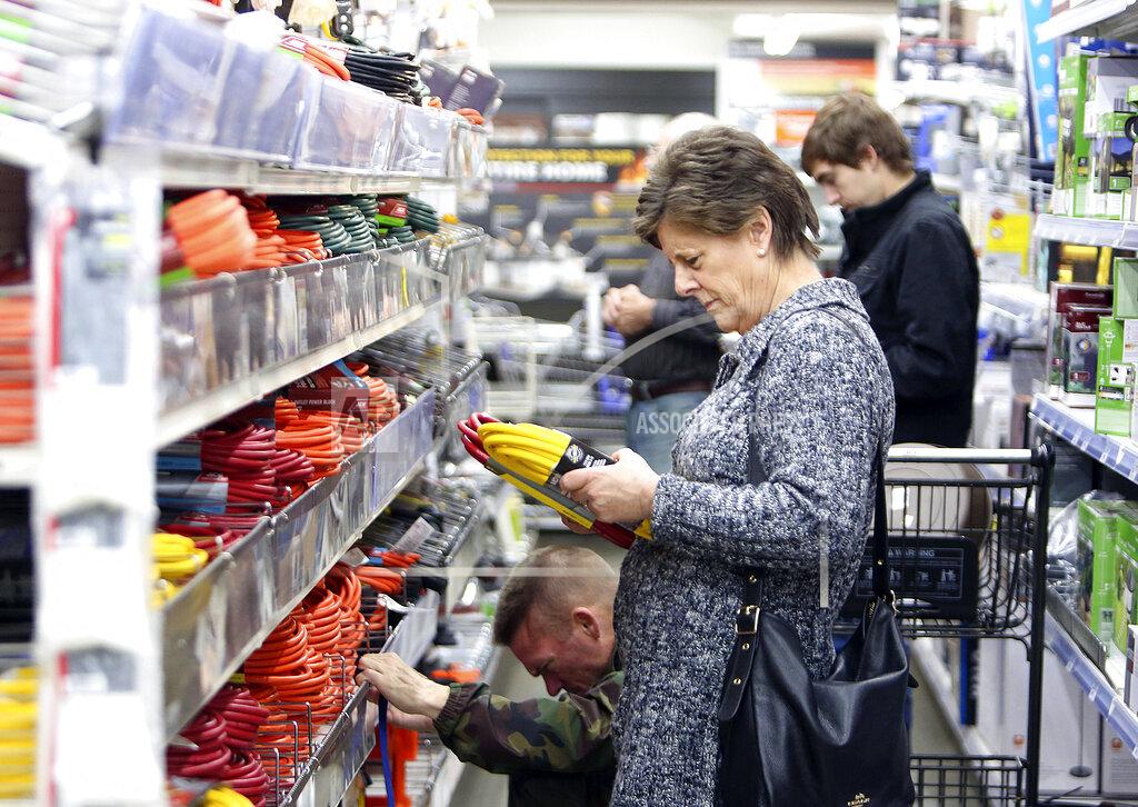 A shopper looks at extension cords at B&C Ace hardware store, Tuesday, Nov. 19, 2019, in Grass Valley, Calif., in preparation of the planned Pacific Gas & Electric power shutdown scheduled for Wednesday and Thursday. (Elias Funez/The Union via AP)