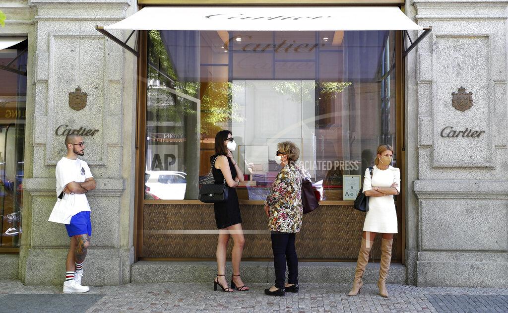 Petr David Josek People wait in line in front of a shop in Prague, Czech Republic, Monday, May 10, 2021. The Czech Republic is massively relaxing its coronavirus restrictions as the hard-hit nation pay respect to nearly 30,000 dead. Monday's wave of easing came after the new infections fell to the levels unseen from August when the government failed to react in time to an opposite trend, the growing numbers of infected which later contributed to record numbers of deaths. (AP Photo/Petr David Josek)