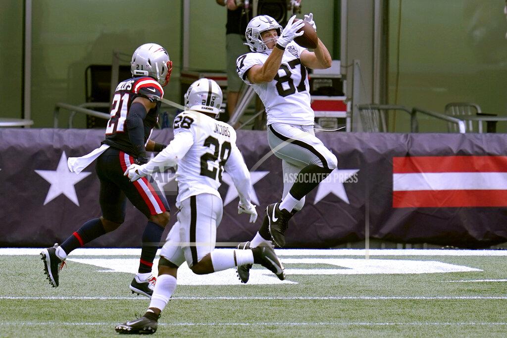 Charles Krupa Las Vegas Raiders tight end Foster Moreau (87) catches a pass for a touchdown in the first half of an NFL football game against the New England Patriots, Sunday, Sept. 27, 2020, in Foxborough, Mass. (AP Photo/Charles Krupa)
