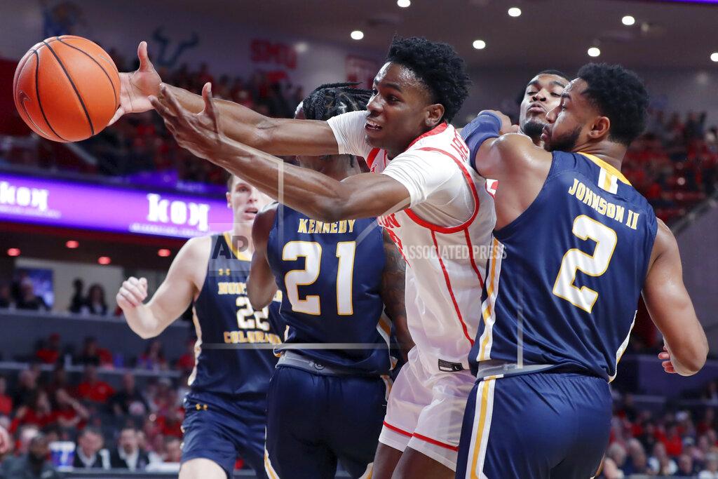 Michael Wyke Houston guard Terrance Arceneaux, center, loses the ball as he tries to shoot between Northern Colorado forward Bryce Kennedy (21) and guard Matt Johnson II (2) during the second half of an NCAA college basketball game Monday, Nov. 7, 2022, in Houston. (AP Photo/Michael Wyke)