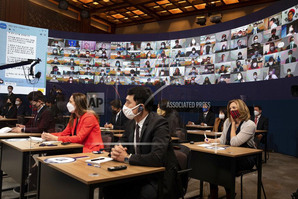 Jeon Heon-Kyun Journalists attend at an on-line New Year press conference by South Korean President Moon Jae-in at the Presidential Blue House in Seoul, South Korea Monday, Jan. 18, 2021. (Jeon Heon-kyun/Pool Photo via AP)