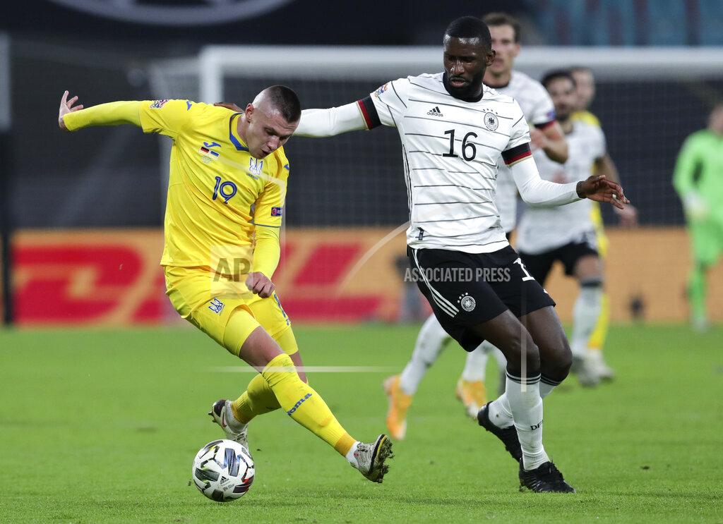 Michael Sohn Ukraine's Oleksandr Subkow, left, and Germany's Antonio Rudiger battle for the ball during the UEFA Nations League soccer match between Germany and the Ukraine at the Red Bull Arena in Leipzig, Germany, Saturday, Nov. 14, 2020. (AP Photo/Michael Sohn)