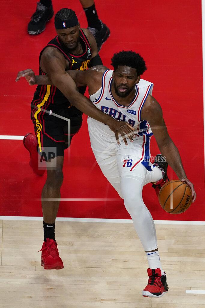 John Bazemore Philadelphia 76ers center Joel Embiid (21) drives past Atlanta Hawks forward Bruno Fernando (24) during the first half of an NBA basketball game Monday, Jan. 11, 2021, in Atlanta. (AP Photo/John Bazemore)