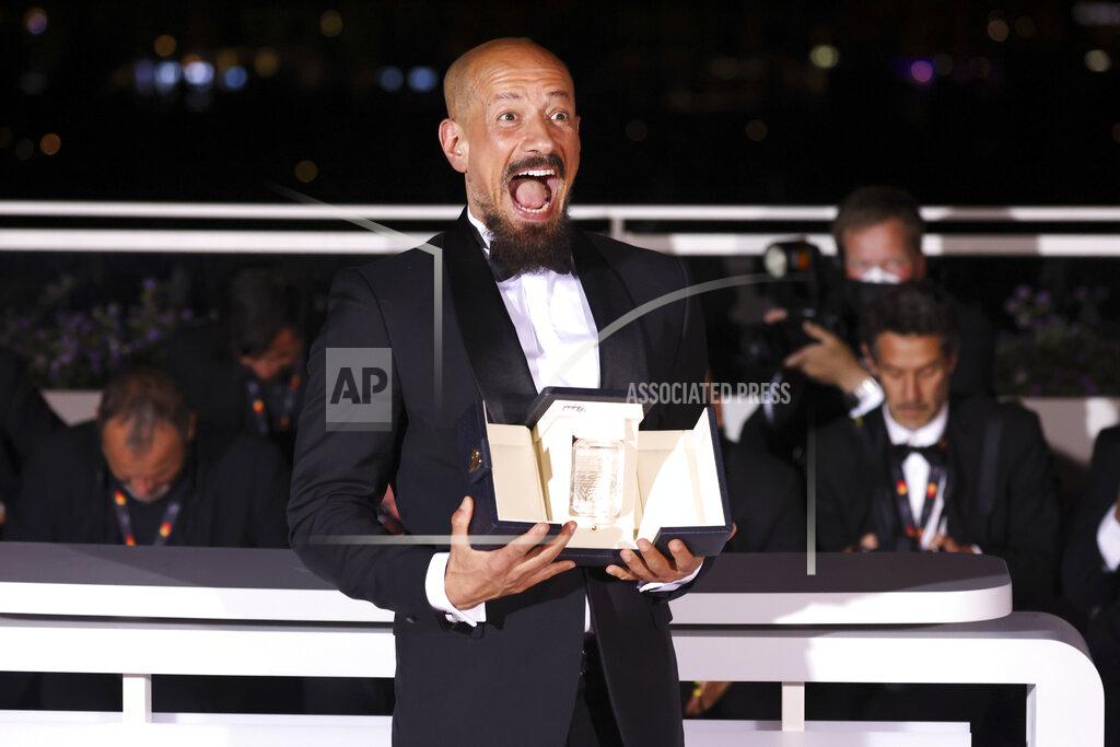 Vianney Le Caer Writer/director Tarik Saleh, winner of the award for best screenplay for 'Boy from Heaven,' poses for photographers during the photo call following the awards ceremony at the 75th international film festival, Cannes, southern France, Saturday, May 28, 2022. (Photo by Vianney Le Caer/Invision/AP)