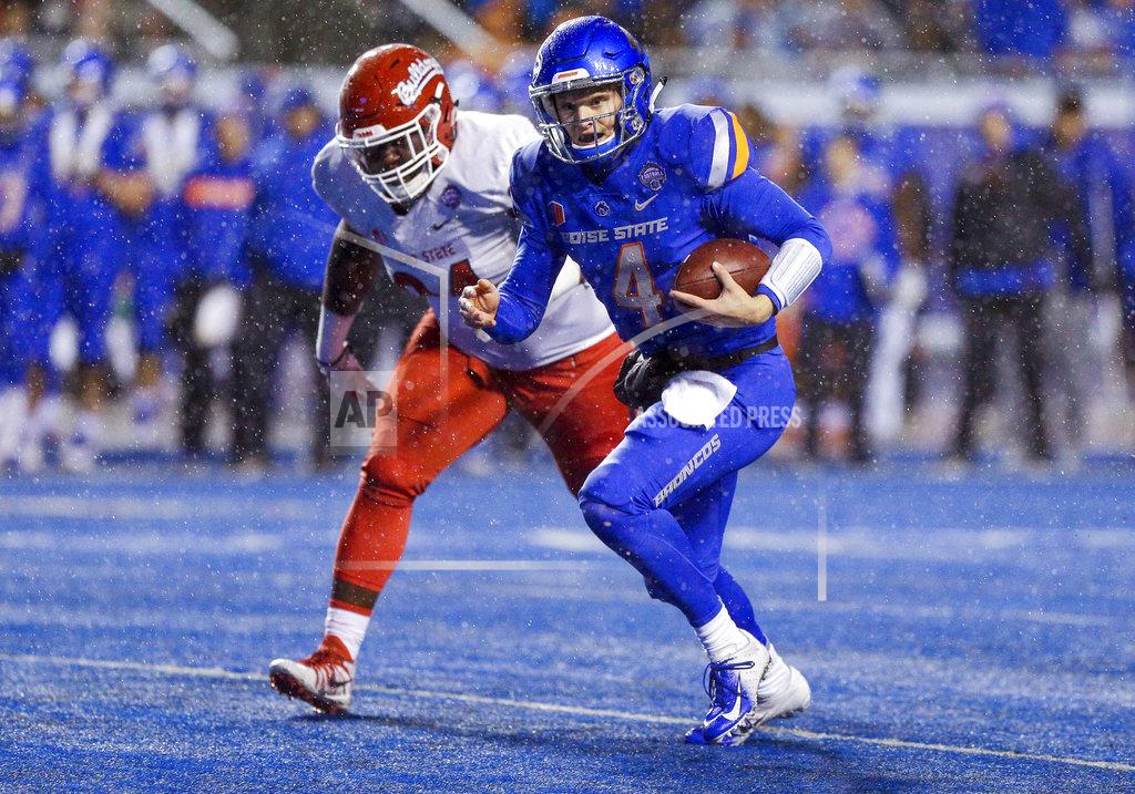 Steve Conner Boise State quarterback Brett Rypien (4) scrambles away from the Fresno State defense during the first half of an NCAA college football game for the Mountain West championship Saturday, Dec. 1, 2018, in Boise, Idaho. (AP Photo/Steve Conner)