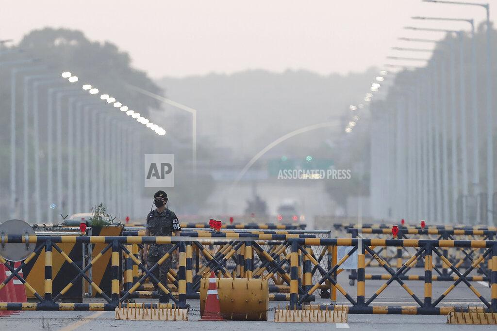 Ahn Young-Joon A South Korean army soldier patrols at the Unification Bridge, which leads to the Panmunjom border village in the Demilitarized Zone in Paju, South Korea. Tuesday, June 16, 2020. North Korea blew up an inter-Korean liaison office building just inside its border in an act Tuesday that sharply raises tensions on the Korean Peninsula amid deadlocked nuclear diplomacy with the United States. (AP Photo/Ahn Young-joon)