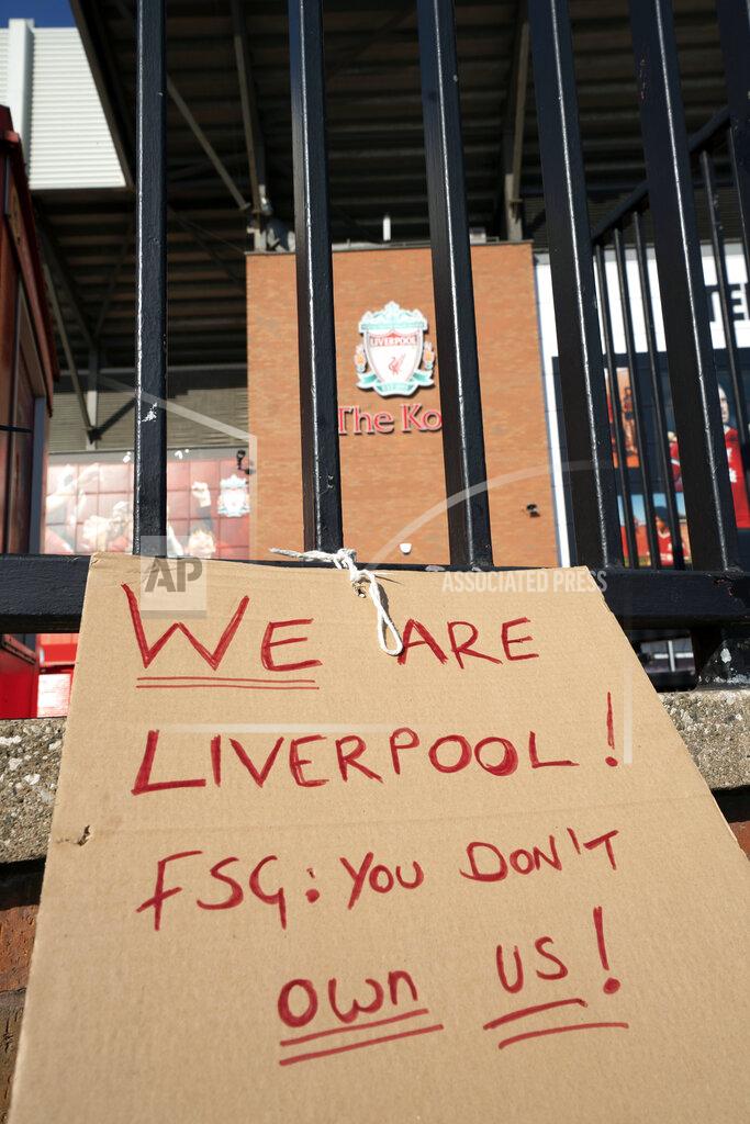 Jon Super A sign is seen outside Liverpool's Anfield Stadium protesting the formation of the European Super League, Liverpool, England, Monday, April 19, 2021. Players at the 12 clubs setting up their own Super League could be banned from this year's European Championship and next year's World Cup, UEFA President Aleksander Ceferin said Monday.