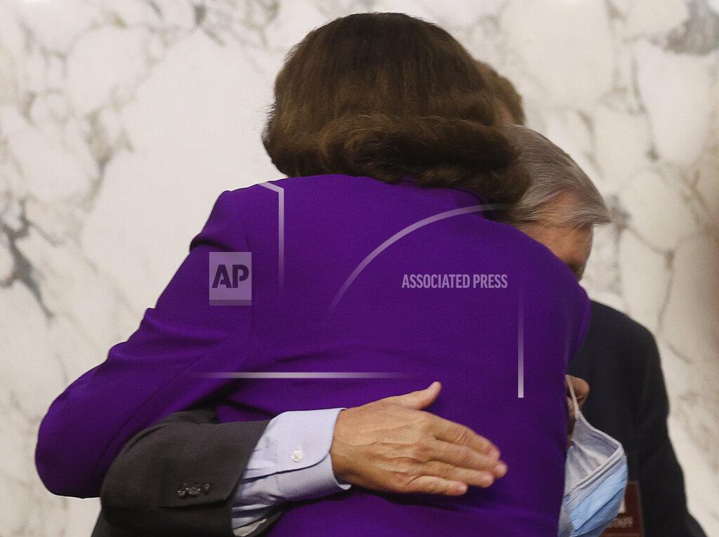 Jonathan Ernst Sen. Lindsey Graham, R-S.C., hugs Sen. Dianne Feinstein, D-Calif., following the fourth day of a confirmation hearing for Supreme Court nominee Amy Coney Barrett, before the Senate Judiciary Committee, Thursday, Oct. 15, 2020, on Capitol Hill in Washington. (Jonathan Ernst/Pool via AP)