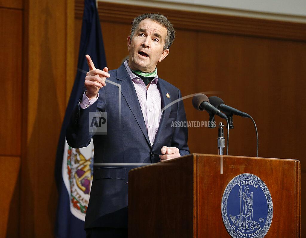 Virginia Gov. Ralph Northam speaks during the COVID-19 update news conference in the Patrick Henry Building Friday May 8, 2020 in Richmond, Va. (Mark Gormus/Richmond Times-Dispatch via AP)