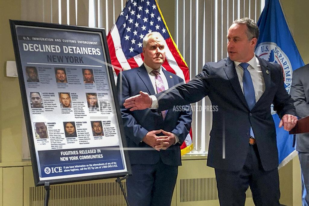 Matthew Albence, right, the acting director of U.S. Immigration and Customs Enforcement, speaks during a news conference, Friday, Jan. 17, 2020, in New York. The country's top immigration official blamed the