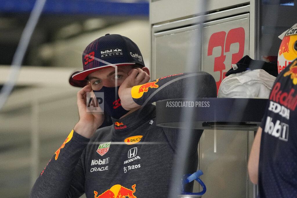 Hassan Ammar Red Bull driver Max Verstappen of the Netherlands stands during practice session for the Saudi Arabian Grand Prix in Jiddah, Friday, Dec. 3, 2021. (AP Photo/Hassan Ammar)