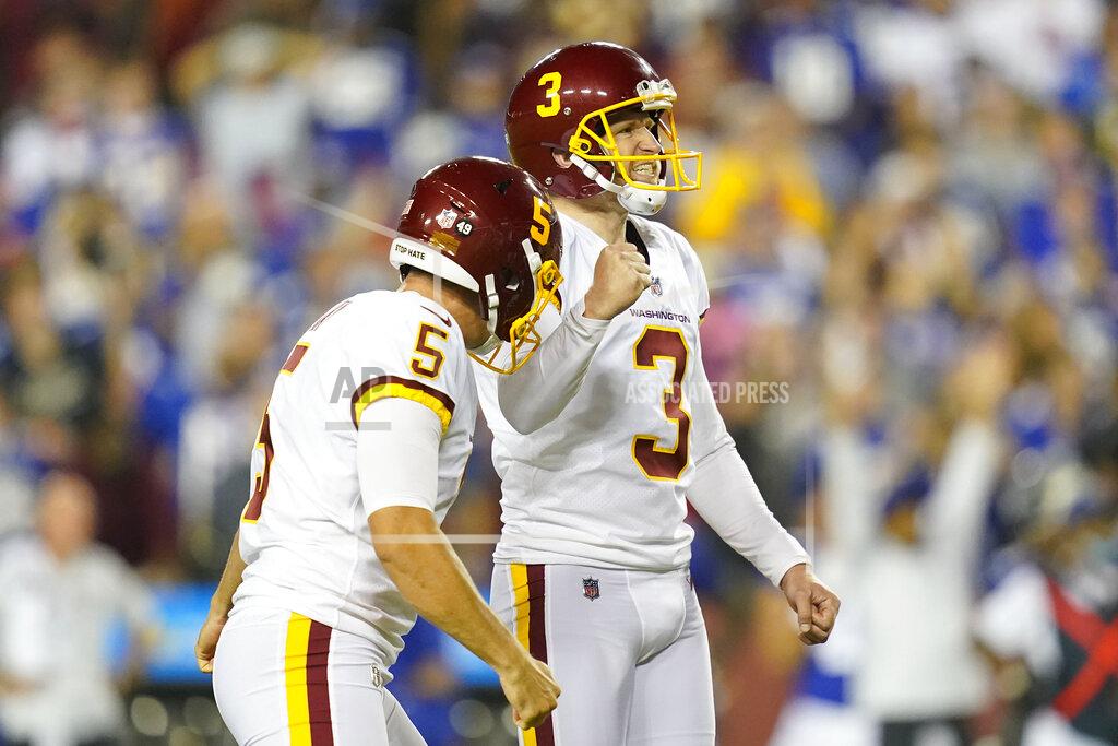 Patrick Semansky Washington Football Team kicker Dustin Hopkins (3) and punter Tress Way (5) reacting to Hopkins' making the winning field goal against the New York Giants during the second half of an NFL football game, Thursday, Sept. 16, 2021, in Landover, Md. Washington won 30 - 29. (AP Photo/Patrick Semansky)