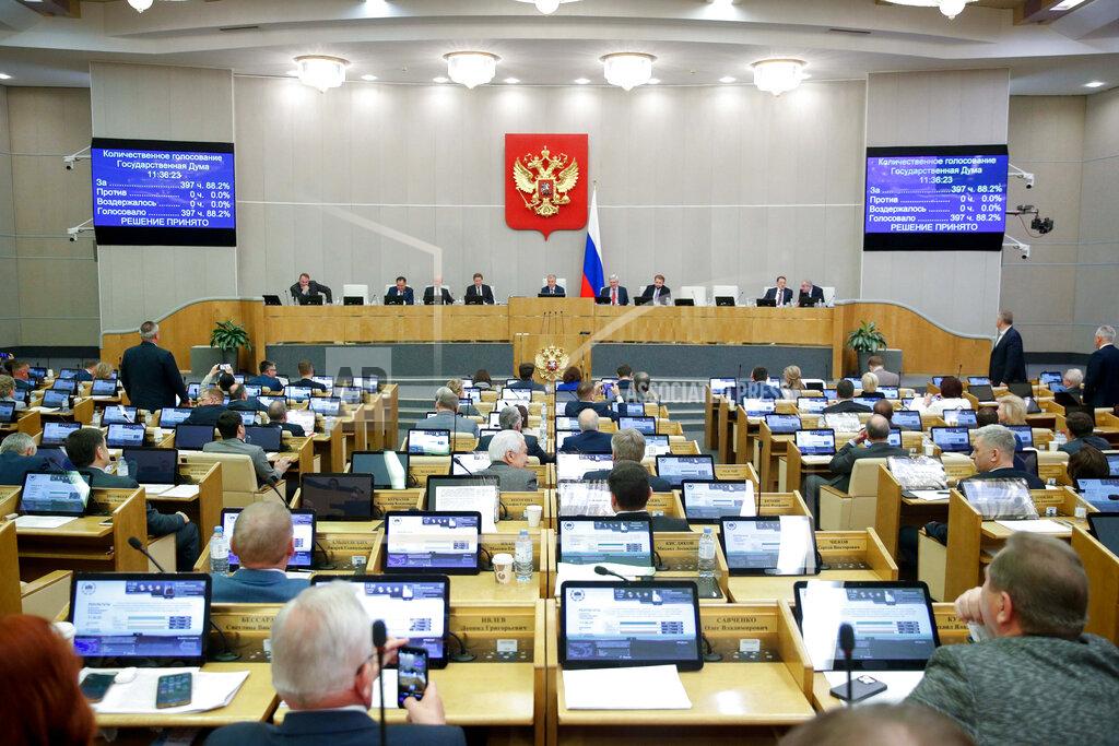 Uncredited In this handout photo provided by The State Duma, The Federal Assembly of The Russian Federation, Russian lawmakers attend a session of the State Duma, the Lower House of the Russian Parliament in Moscow, Russia, Thursday, Nov. 24, 2022. Russian lawmakers have given their final approval to a bill that significantly expands restrictions on activities seen as promoting LGBTQ rights in the country. (The State Duma, The Federal Assembly of The Russian Federation via AP)