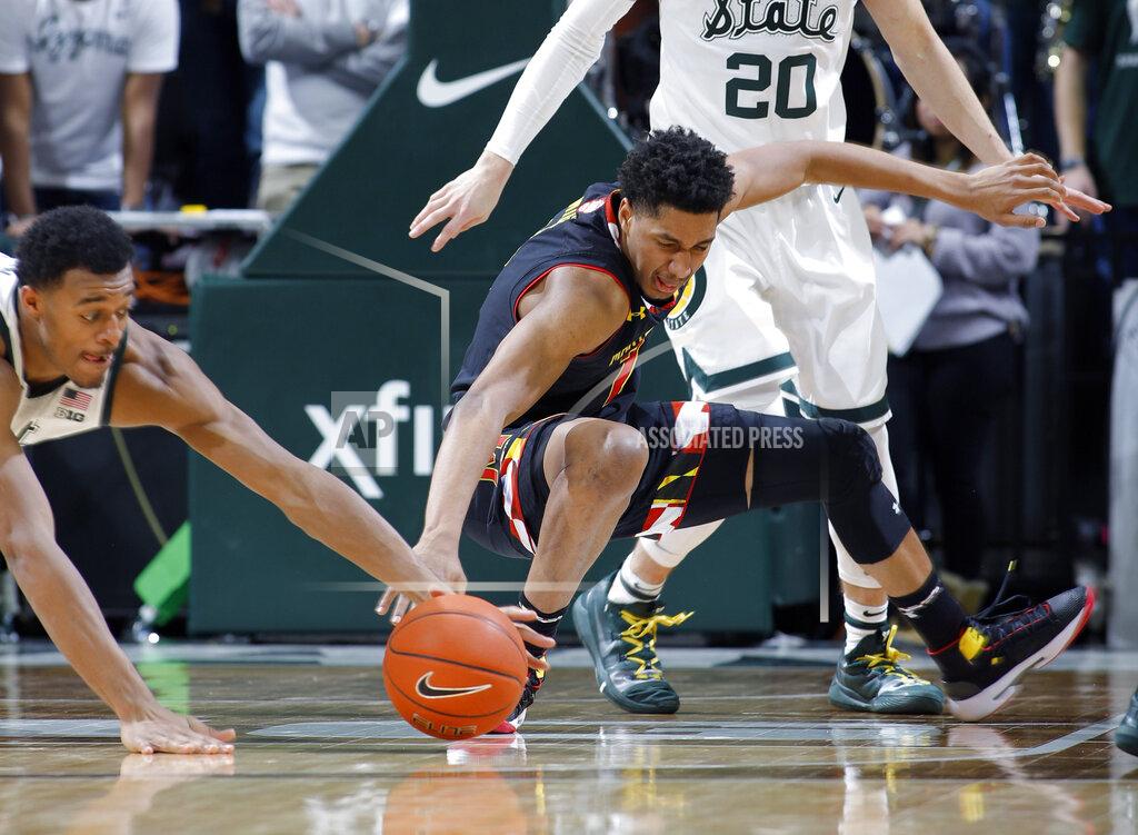 Al Goldis Michigan State's Xavier Tillman, left, pulls in the ball after Maryland's Aaron Wiggins, right, lost it on a dribble during the second half of an NCAA college basketball game, Monday, Jan. 21, 2019, in East Lansing, Mich. Michigan State won 69-55. (AP Photo/Al Goldis)