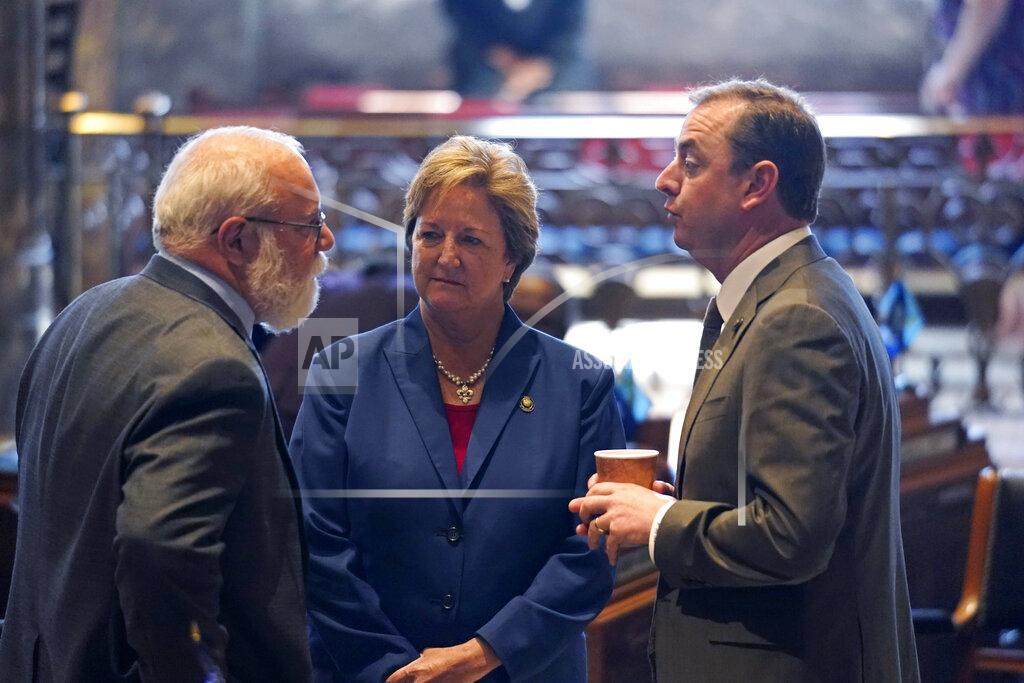 Gerald Herbert Bret Allain, R-Franklin, left, chairman of the Senate Revenue and Fiscal Affairs Committee, talks with Sen. Sharon Hewitt,R-Slidell, and Sen. Patrick McMath, R-Covington, during opening day of the Louisiana legislative session in Baton Rouge, La., Monday, April 12, 2021. (AP Photo/Gerald Herbert)