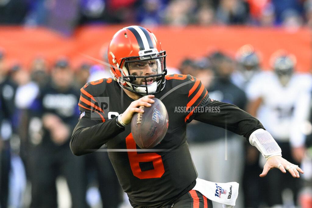 David Richard FILE - In this Dec. 22, 2019, file photo, Cleveland Browns quarterback Baker Mayfield scrambles during the second half of an NFL football game against the Baltimore Ravens in Cleveland. Looking back, Browns rookie coach Kevin Stefanski is now thrilled he decided to take a trip to Texas in March to visit Baker Mayfield. During a Zoom conference call on Friday, Aug. 7, 2020, Stefanski revealed that he went to Austin and spent time with Mayfield. (AP Photo/David Richard, File)