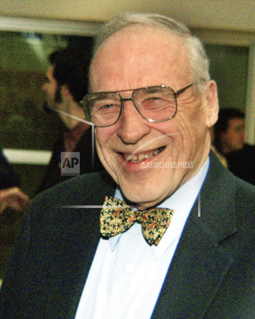 Phil Grout FILE - This Jan. 16, 2003, file photo shows Mount St. Mary's men's basketball coach Jim Phelan after announcing his retirement, in Emmitsburg, Md. Phelan, the bow-tied basketball coach who won 830 games during nearly a half-century at Mount St. Mary's, has died. He was 92. The athletic department at Mount St. Mary's said Phelan died in his sleep at home Tuesday night, June 15, 2021. (AP Photo/Phil Grout, File)