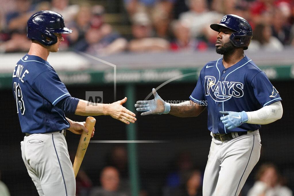 Tony Dejak Tampa Bay Rays' Randy Arozarena, right, is congratulated by Joey Wendle after Arozarena scored in the 10th inning of the team's baseball game against the Cleveland Indians, Thursday, July 22, 2021, in Cleveland. Tampa won 5-4 in 10 innings. (AP Photo/Tony Dejak)