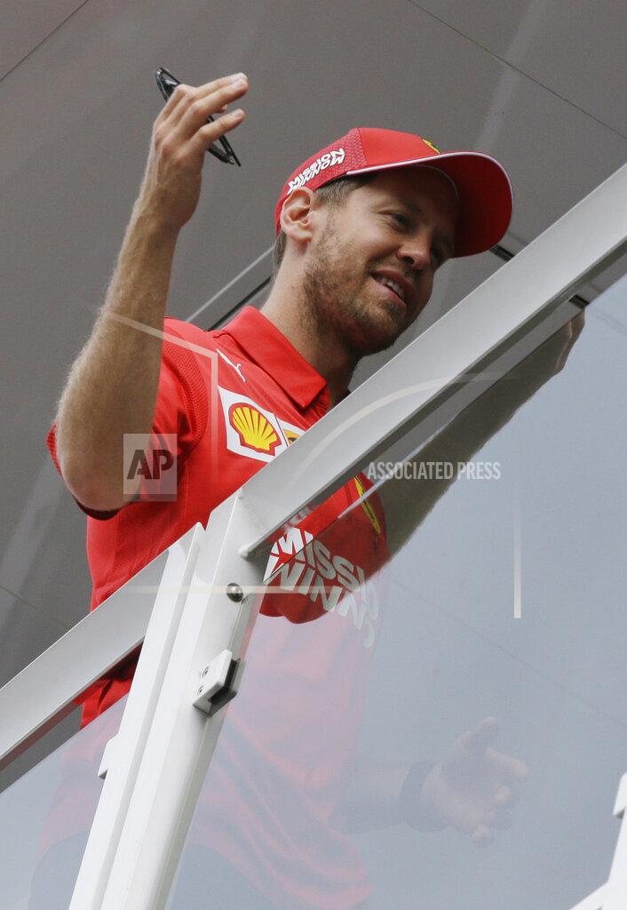 Luca Bruno Ferrari driver Sebastian Vettel of Germany gestures on the Ferrari's motorhome at the Monaco racetrack, in Monaco, Wednesday, May 22, 2019. The Formula one race will be held on Sunday. (AP Photo/Luca Bruno)