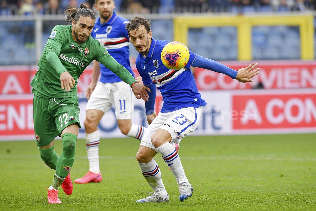 Fiorentina's Martin Caceres, left vies for the ball with Sampdoria's Manolo Gabbiadini during a Serie A soccer match between Fiorentina and Sampdoria at the Luigi Ferraris Stadium in Genoa, Italy, Sunday, Feb. 16, 2020. (Tano Pecoraro/Lapresse via AP)