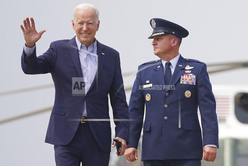 Andrew Harnik President Joe Biden walks with Col. Matthew E. Jones, Commander of the 89th Airlift Wing, to board Air Force One at Andrews Air Force Base, Md., Wednesday, July 21, 2021, to travel to Cincinnati for a town hall and to tour an electrical training center. (AP Photo/Andrew Harnik)