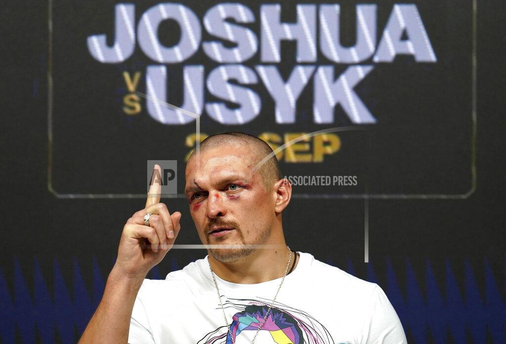 Nick Potts Oleksandr Usyk of Ukraine gestures during a press conference after winning the WBA (Super), WBO and IBF boxing title bout against Anthony Joshua of Britain at the Tottenham Hotspur Stadium in London Saturday Sept. 25, 2021. (Nick Potts/PA via AP)