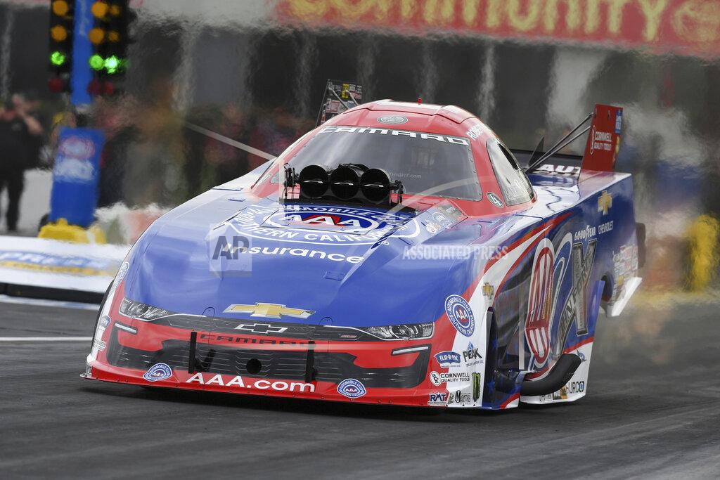Jerry Foss In this photo provided by the NHRA, Robert Hight tallies his fourth win at the at the Mopar Express Lane NHRA SpringNationals at Houston Raceway Park in Baytown, Texas, Monday, May 24, 2021, after rain on Sunday delayed racing. (Jerry Foss/NHRA via AP)