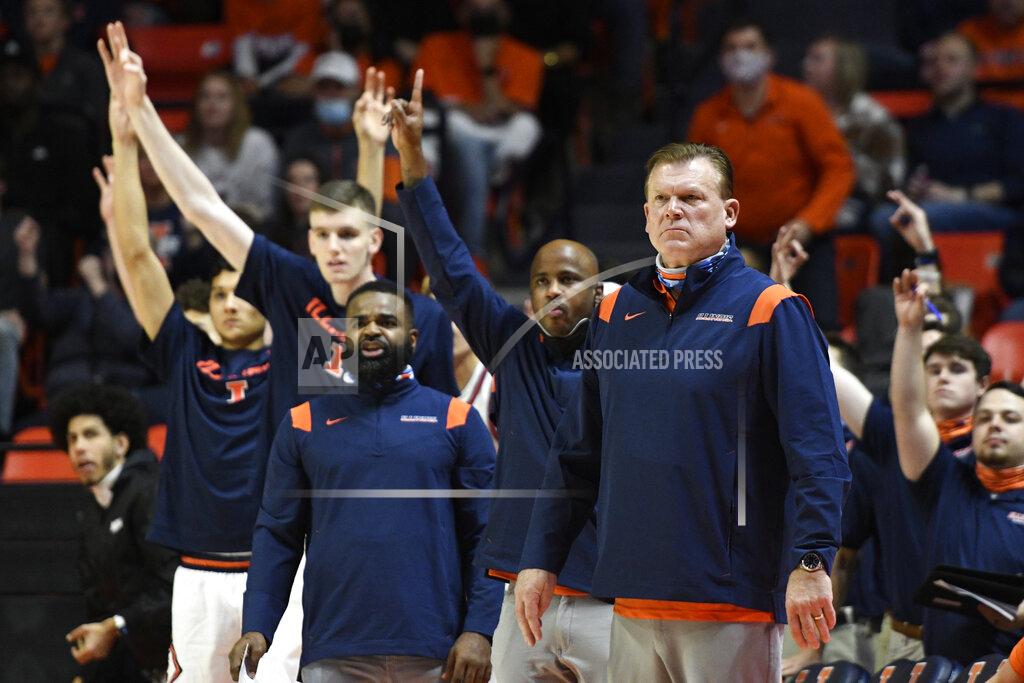 Michael Allio Illinois coach Brad Underwood surveys the court as the team bench celebrates during the first half of the team's NCAA college basketball game against Rutgers on Friday, Dec. 3, 2021, in Champaign, Ill. (AP Photo/Michael Allio)