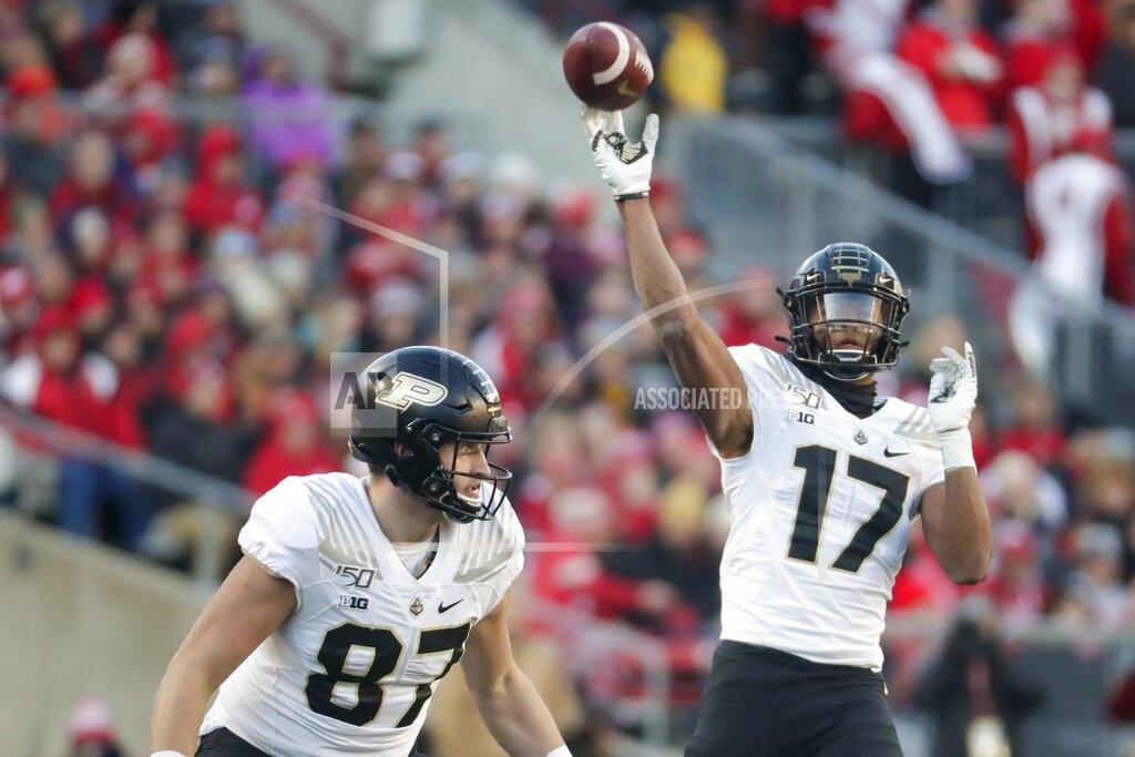 Morry Gash Purdue's Byron Perkins throws during the first half of an NCAA college football game against Wisconsin Saturday, Nov. 23, 2019, in Madison, Wis. (AP Photo/Morry Gash)