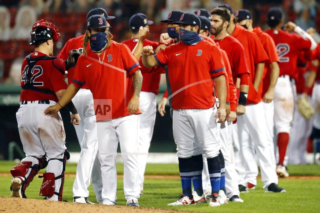 Michael Dwyer The Boston Red Sox celebrate after defeating the Washington Nationals during a baseball game, Saturday, Aug. 29, 2020, in Boston. (AP Photo/Michael Dwyer)