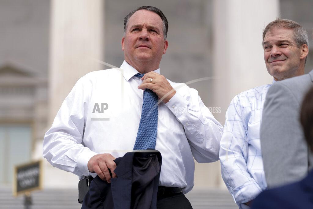 Andrew Harnik FILE - Rep. Alexander Mooney, R-W.Va., left, and Rep. Jim Jordan, R-Ohio, right, appear at a news conference on the steps of the Capitol in Washington, July 29, 2021. A Republican primary in West Virginia's 2nd Congressional District between two incumbents, Rep. David McKinley and Mooney, could hang on support for President Joe Biden's $1.2 trillion infrastructure law in the GOP-leaning state. (AP Photo/Andrew Harnik, File)