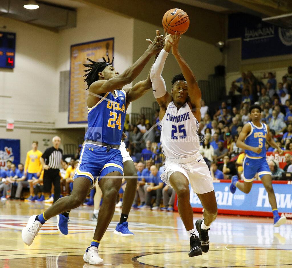 Marco Garcia UCLA forward Jalen Hill (24) and Chaminade guard Kendall Small (25) fight for a loose ball during the first half of an NCAA college basketball game Tuesday, Nov. 26, 2019, in Lahaina, Hawaii. (AP Photo/Marco Garcia)