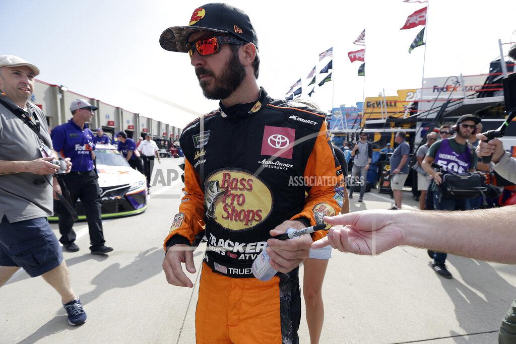 Gerry Broome Martin Truex Jr. signs autographs for fans during practice prior to Sunday's NASCAR Cup Series auto race at Charlotte Motor Speedway in Concord, N.C., Saturday, Sept. 28, 2019. (AP Photo/Gerry Broome)